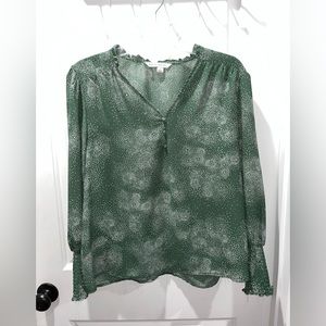 Green blouse with white dots. Buttons to show more or less chest.